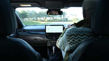 Auto Express creative director Darren Wilson driving a Ford Focus