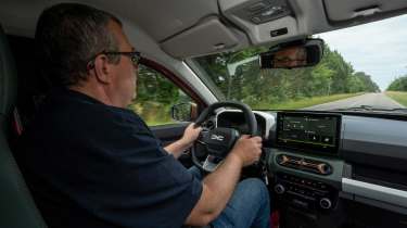 John McIlroy driving the Dacia Spring