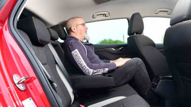 Skoda Scala - rear seats with Senior test editor, Dean Gibson