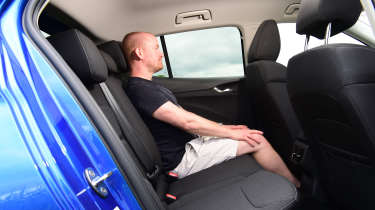 Auto Express chief reviewer Alex Ingram sitting in the Skoda Fabia&#039;s back seat