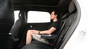 Auto Express consumer editor Tom Jervis sitting in the Omoda 7 SHS-P Noble Tech's rear seat