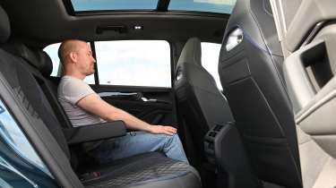 Volkswagen Tiguan - rear seats being sat in by Auto Express chief reviewer Alex Ingram