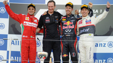 Felipe Massa, Paul Monaghan (Red Bull head of Car Engineering), Sebastian Vettel and Kamui Kobayashi on the podium