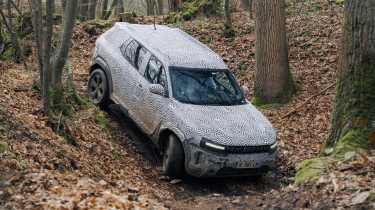 Dacia Duster descending a sharp gradient