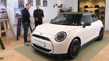 Richard Ingram with MINI’s head of design, Holger Hampf next to a MINI Cooper