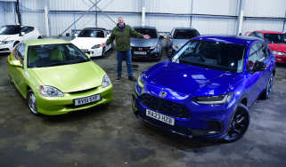 Auto Express current affairs and features editor Chris Rosamond standing between a Mk1 Honda Insight and a Honda ZR-V