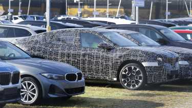 BMW iX4 - front angled parked