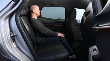 Auto Express chief reviewer Alex Ingram sitting in the Cupra Tavascan&#039;s back seat