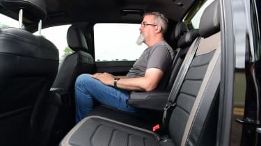 Auto Express senior test editor Dean Gibson sitting in back seat of Volkswagen Amarok