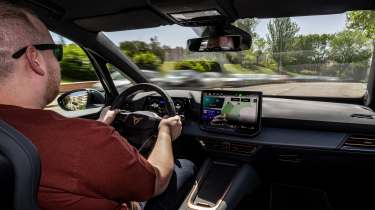 Cupra Born facelift - front interior, car being driven in Spain by Auto Express news reporter Ellis Hyde
