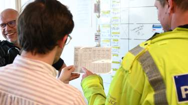 Auto Express consumer reporter Tom Jervis looking at a sheet of drug-related driving offences
