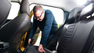Auto Express editor-at-large John McIlroy inspecting the Jeep Avenger&#039;s back seats