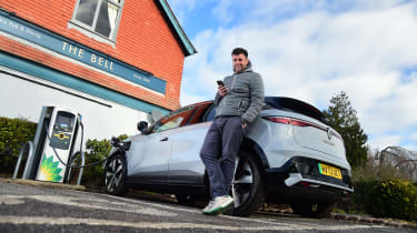Steve Walker charging Renault Megane E-Tech outside pub