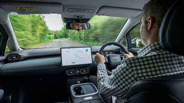 Richard Ingram driving the Aion UT
