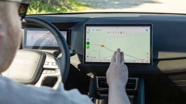 Ellis Hyde using the touchscreen in the BYD Atto 2