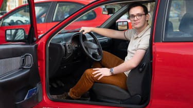 Auto Express consumer reporter Tom Jervis sitting in a Mk2 SEAT Ibiza