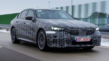 Camouflaged BMW i5 winter testing (official picture) - front tracking (dry)