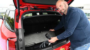 Auto Express creative director Darren Wilson removing the MINI Countryman JCW&#039;s charging cables