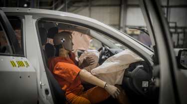 Crash test dummies in a crashed car