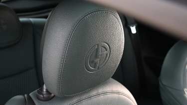 Fiat 500e Giorgio Armani Collector&#039;s Edition - Giorgio Armani logo embossed into front seat headrest 
