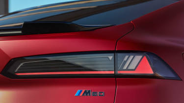 BMW iX4 M60 - rear badge