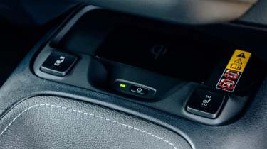 Toyota Corolla Excel in the UK - centre console, heated seats and wireless phone charging pad