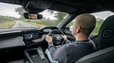 New Peugeot E-408 2025 - car being driven by Auto Express chief reviewer, Alex Ingram