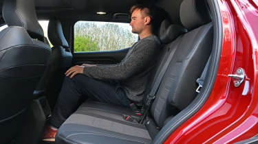 Alastair Crooks sitting in the Suzuki e Vitara prototype