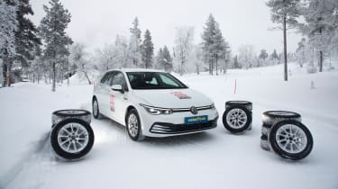 Volkswagen Golf surrounded by winter tyres