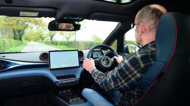 Auto Express chief sub-editor Andy Pringle driving the BYD Dolphin