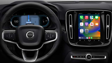 Volvo dashboard with infotainment screen displaying Apple CarPlay homescreen