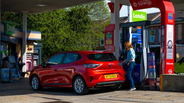 Auto Express pictures editor Dawn Grant refuelling the Renault Clio