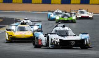 Le Mans racing cars on the Dunlop Chicane