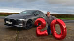 Auto Express senior photographer Pete Gibson crouching next to the Mazda 3 while holding number-shaped balloons