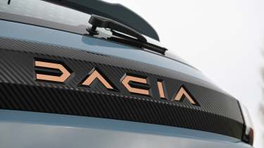 Dacia Spring - bootlid badge