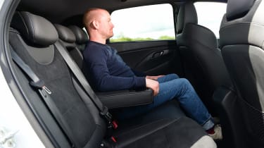 Auto Express chief reviewer Alex Ingram sitting in back seat of Hyundai i30 N