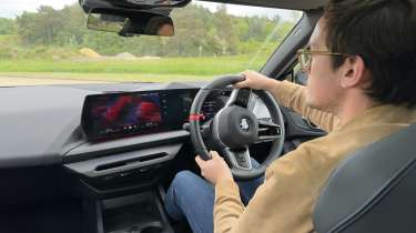 Auto Express consumer reporter Tom Jervis driving the BMW M235i