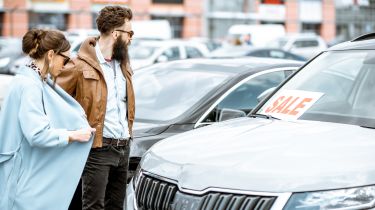 Two people looking at a Skoda for sale