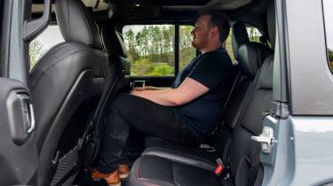 Auto Express news reporter Ellis Hyde sitting in the Jeep Wrangler Rubicon&#039;s back seat