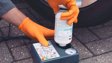 Person using a tyre puncture repair kit