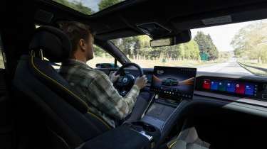 Auto Express senior news reporter Alastair Crooks driving the Denza Z9GT EV