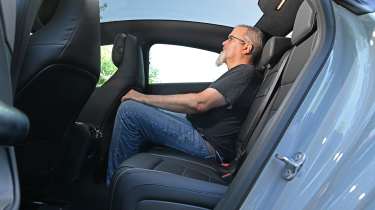 Auto Express senior road test editor Dean Gibson sitting the Mercedes CLA Hybrid's rear seat