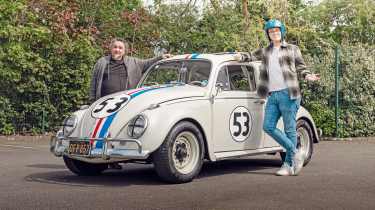 Auto Express consumer reporter Tom Jervis standing next to a &#039;Herbie&#039; Volkswagen Beetle