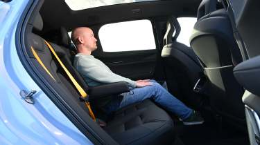 Polestar 3 - rear seats being sat in by Auto Express chief reviewer Alex Ingram 