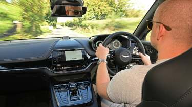 Auto Express contributor Alex Ingram diving the Aston Martin DBX S