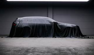 BMW M5 Touring teased - side profile under a sheet