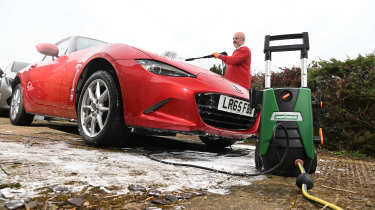 Auto Express Product Awards 2026 - products editor Tom Barnard washing his car using the Hawksmore pressure washer
