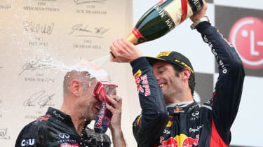 Red Bull Chief Technical Officer Adrian Newey and Mark Webber celebrate
