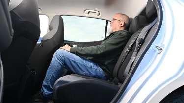 Auto Express senior test editor Dean Gibson sitting in the MG4 Urban's rear seat