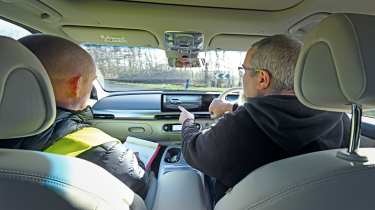 Auto Express senior road test editor Dean Gibson testing the Genesis GV60&#039;s infotainment system